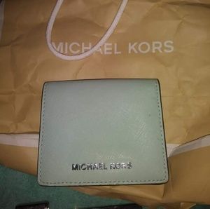Assorted Michael kors and Coach wallets